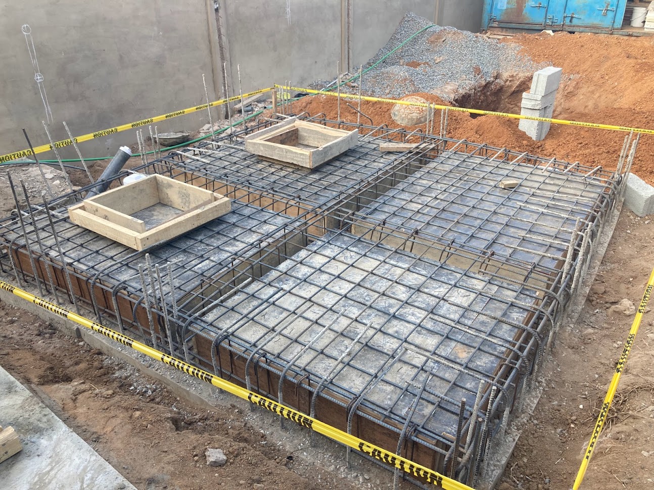 Reinforced concrete raft foundation with rebar cage ready for concrete pour on a building project in Accra, Ghana — structural engineering by Nee Addottey Allotey